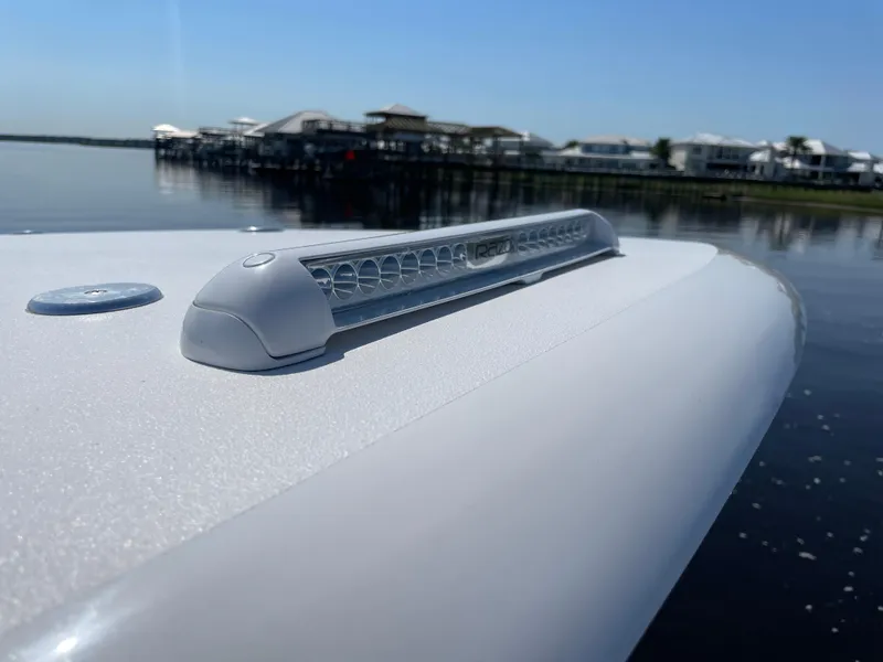 Slide: The Image of 2023 Front Runner 26 Center Console boat detail with LED light, dockside view. - 30