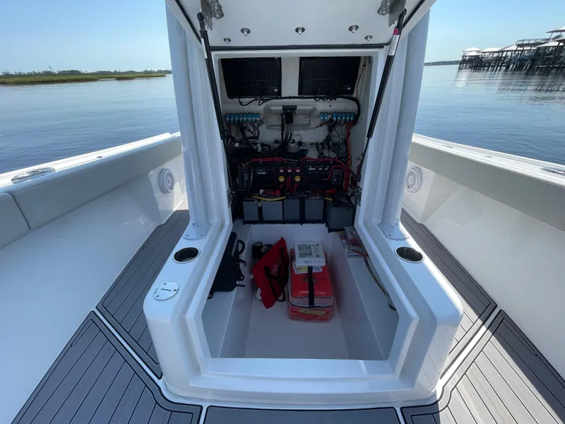 Slide: The Image of 2023 Front Runner 26 Center Console boat interior with open storage compartment. - 33