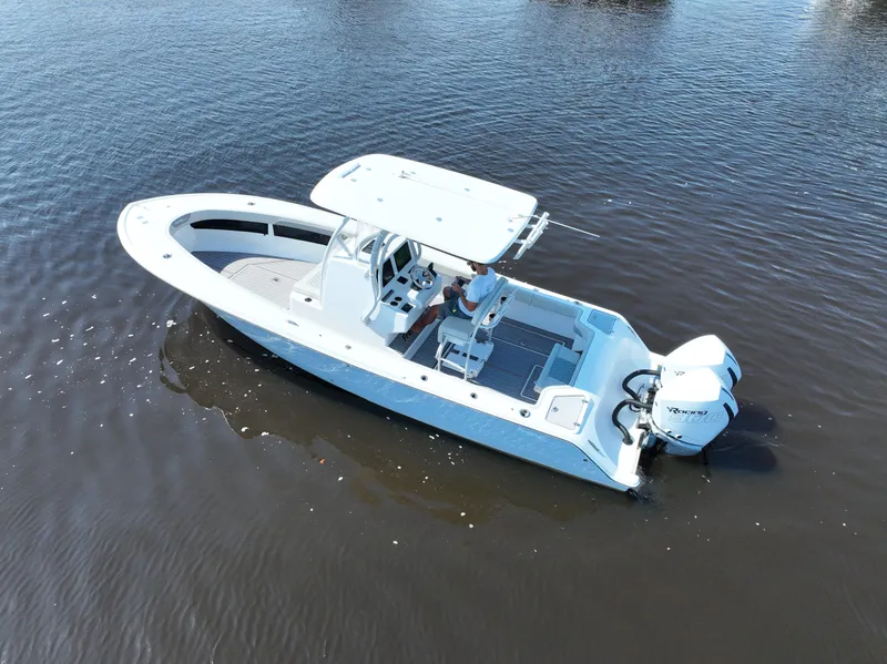 Slide: The Image of 2023 Front Runner 26 Center Console boat on calm water, aerial view. - 4