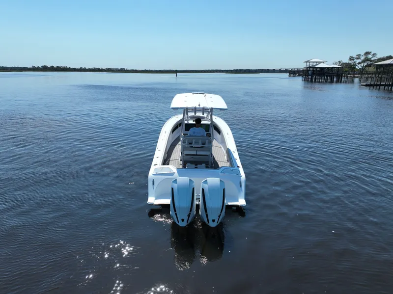 Slide: The Image of 2023 Front Runner 26 Center Console boat cruising on a calm lake. - 5