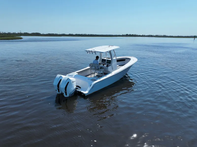 Slide: The Image of 2023 Front Runner 26 Center Console boat cruising on calm water. - 6