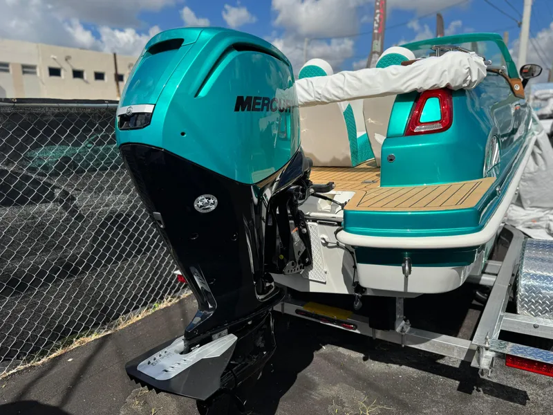 Slide: The Image of Turquoise Car Off-shore Fiat 500 Classic boat with Mercury outboard motor, 2025 model. - 23