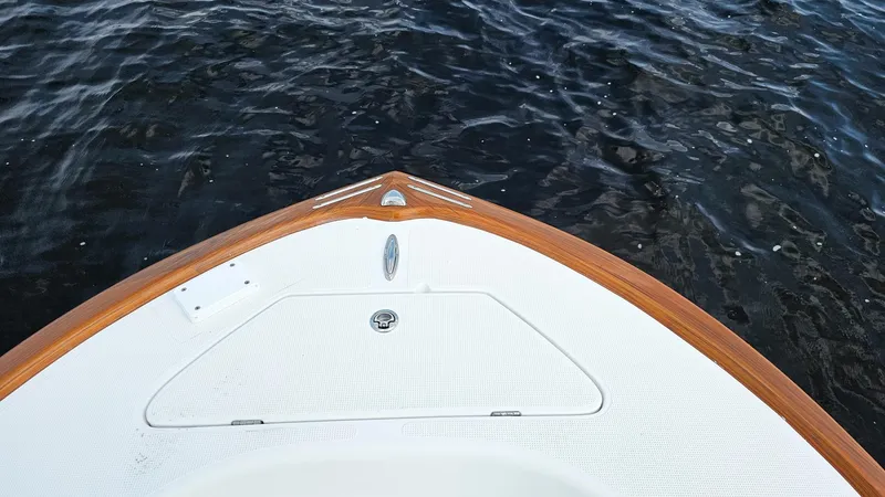 Slide: The Image of Bow of 2025 Chaos 21 Tarpon Bay boat on water. - 6