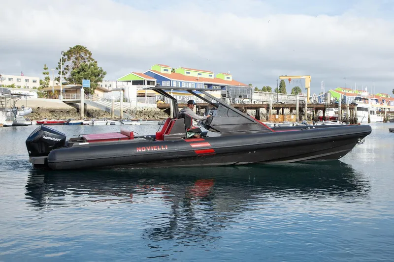 Slide: The Image of 2023 Novielli Veloche 349 boat on calm water near colorful buildings. - 3