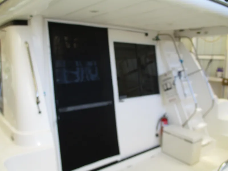 Slide: The Image of 2000 Bayliner 5288 Pilot House yacht interior with white and black accents. - 14