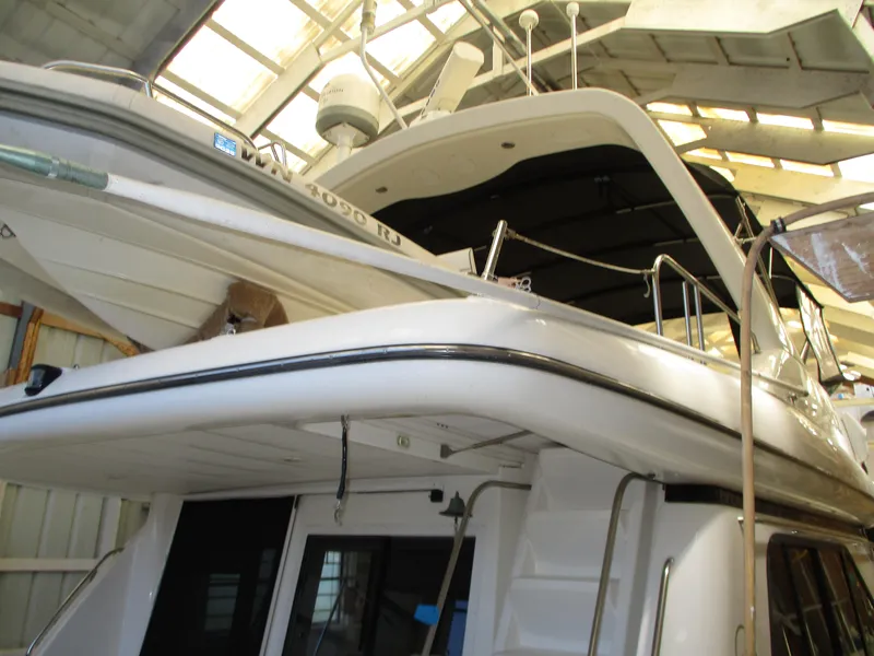 Slide: The Image of 2000 Bayliner 5288 Pilot House yacht in a covered storage facility. - 21