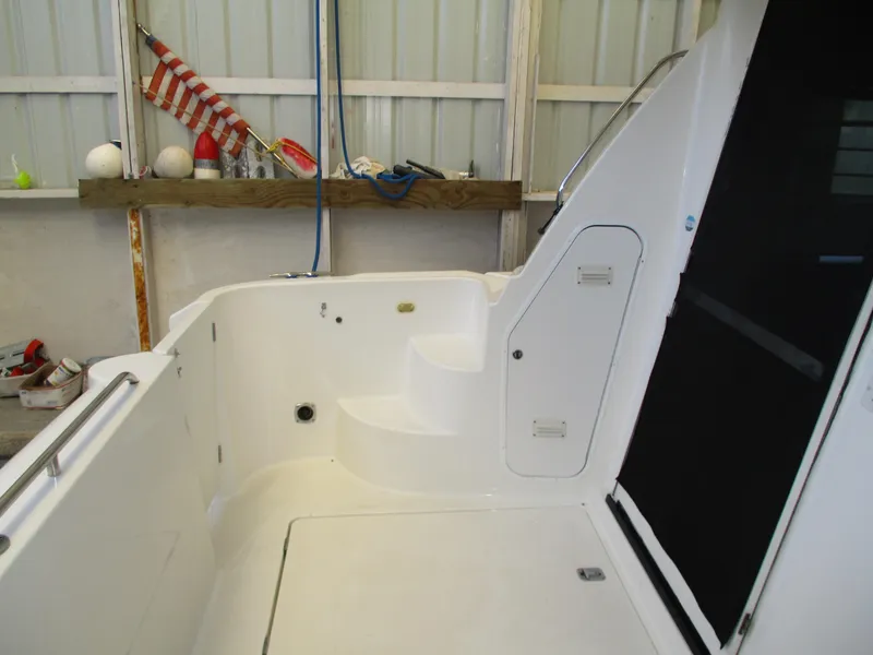 Slide: The Image of 2000 Bayliner 5288 Pilot House boat interior with steps and storage compartments. - 22