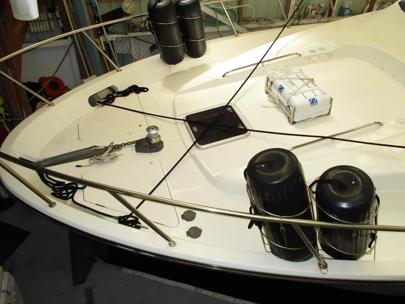 Slide: The Image of Bayliner 5288 Pilot House 2000 boat deck with anchor and safety equipment. - 4