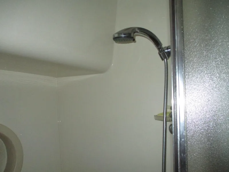 Slide: The Image of Shower area in 2000 Bayliner 5288 Pilot House yacht bathroom. - 49
