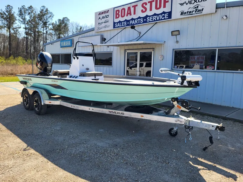 The Image of 2025 Vexus ACX 2000 boat on trailer outside dealership, sunny day. - 0