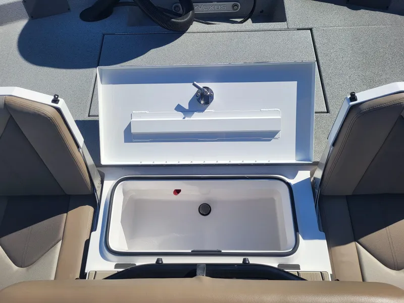 Slide: The Image of Open storage compartment in 2025 Vexus ACX 2000 boat, featuring beige seating. - 12