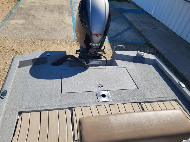 Slide: The Image of 2025 Vexus ACX 2000 boat with a 150 horsepower engine, rear deck view. - 13