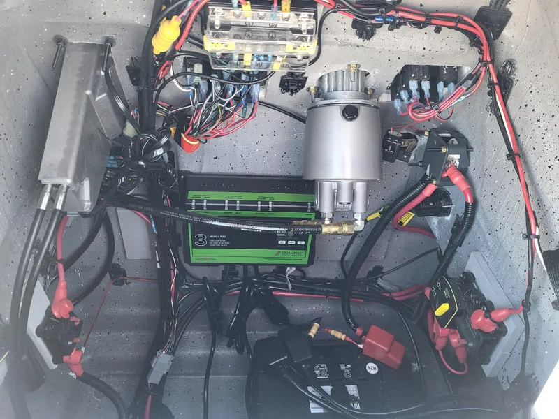 Slide: The Image of Electrical wiring and components inside a 2025 Vexus ACX 2000 boat. - 21