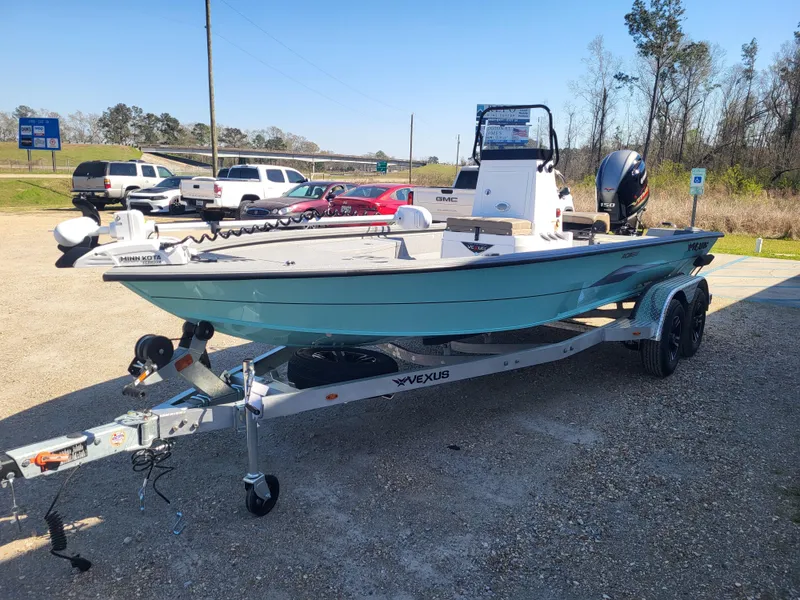 Slide: The Image of 2025 Vexus ACX 2000 boat on trailer in outdoor parking lot. - 5