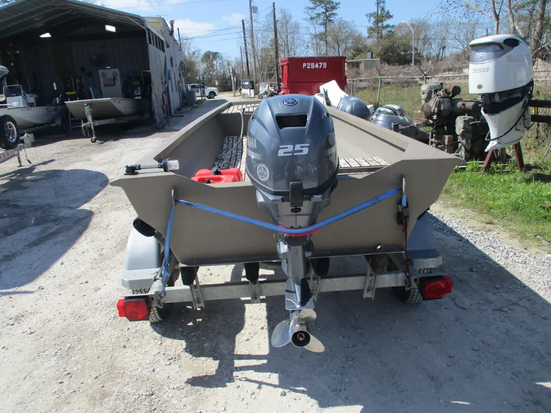 Slide: The Image of Custom 15 Aluminum boat, 2023 model, with 25 HP outboard motor on trailer. - 4