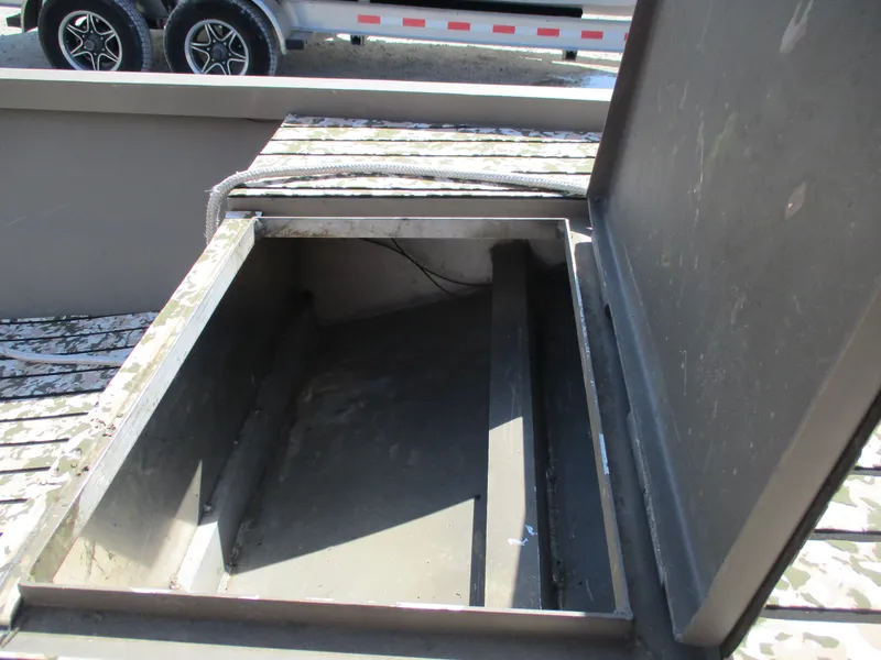 Slide: The Image of Open storage compartment on a 2023 Custom 15 Aluminum trailer. - 5
