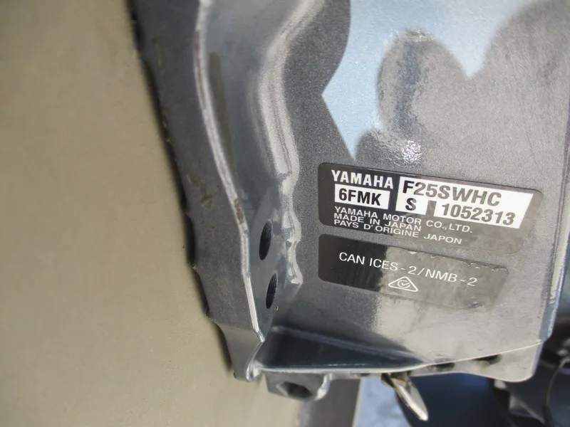 Slide: The Image of Label on Yamaha motor, model F25SWHC, showing serial number and compliance information. - 7