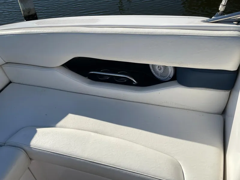 Slide: The Image of 2008 Regal 2700 Bowrider interior with white seating and speaker detail. - 13