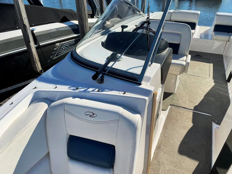 Slide: The Image of 2008 Regal 2700 Bowrider boat interior with white seating and windshield. - 4