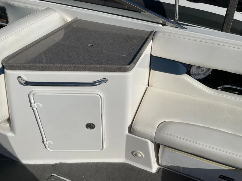 Slide: The Image of 2008 Regal 2700 Bowrider interior with white seating and storage compartment. - 8