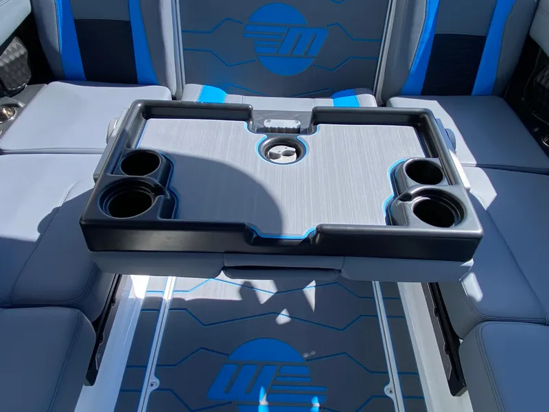 Slide: The Image of 2025 Malibu Wakesetter 23 MXZ interior with cup holders and stylish seating. - 13