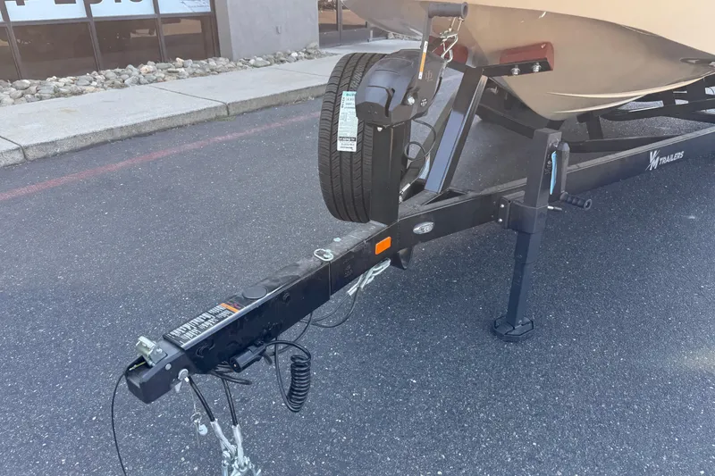 Slide: The Image of Trailer hitch of MB B52 21 Alpha 2025 boat, parked on asphalt. - 10