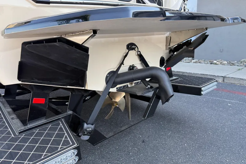 Slide: The Image of Rear view of 2025 MB B52 21 Alpha boat with propeller and exhaust system. - 13