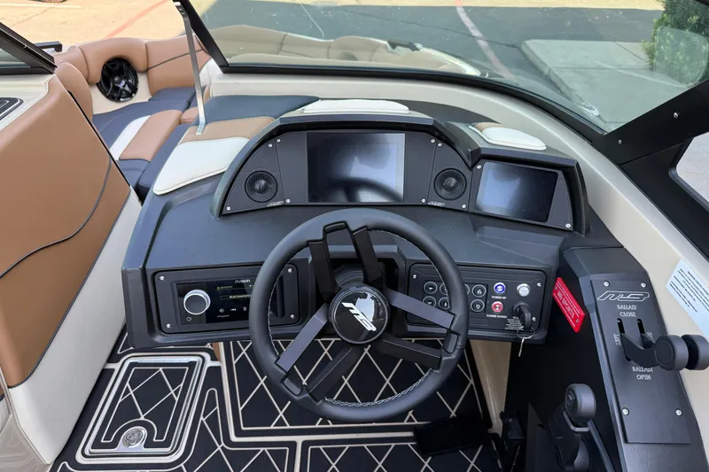 Slide: The Image of 2025 MB B52 21 Alpha boat dashboard with modern controls and steering wheel. - 14