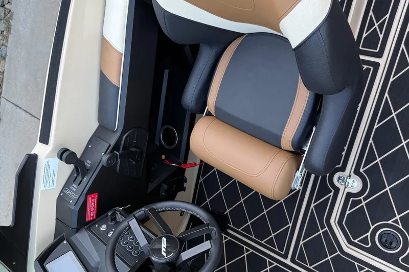 Slide: The Image of 2025 MB B52 21 Alpha boat interior with steering wheel and leather seating. - 16