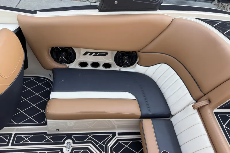 Slide: The Image of Luxurious interior of 2025 MB B52 21 Alpha boat with tan and black seating. - 17