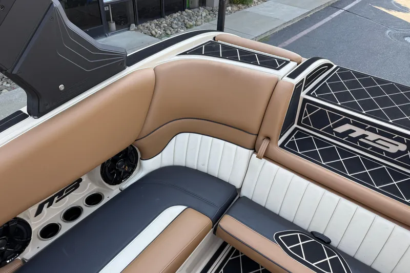 Slide: The Image of Luxurious interior of 2025 MB B52 21 Alpha boat with tan and black seating. - 18