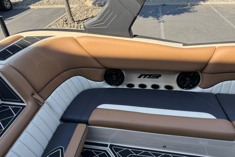 Slide: The Image of Luxurious interior of 2025 MB B52 21 Alpha boat with premium seating and speakers. - 21