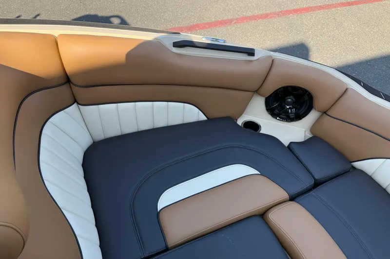 Slide: The Image of Luxurious interior of 2025 MB B52 21 Alpha boat with brown and white seating. - 24