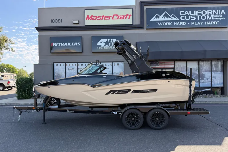 Slide: The Image of 2025 MB B52 21 Alpha boat on trailer, parked outside California Custom Trailers & Powersports. - 4