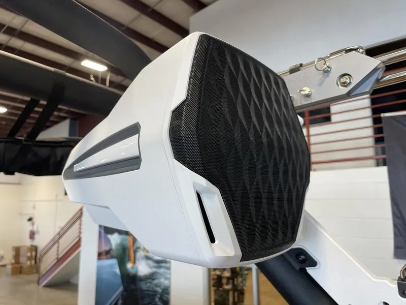 Slide: The Image of 2025 Malibu M230 boat speaker with modern design in a showroom setting. - 26