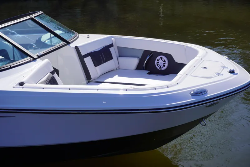 Slide: The Image of 2025 Monterey M22 boat with sleek design and comfortable seating on calm water. - 1