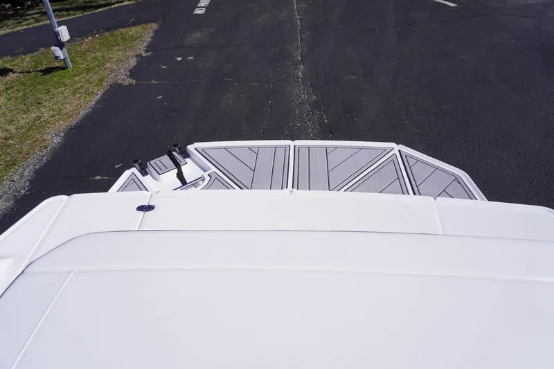 Slide: The Image of 2025 Monterey M22 boat rear deck on asphalt road. - 12