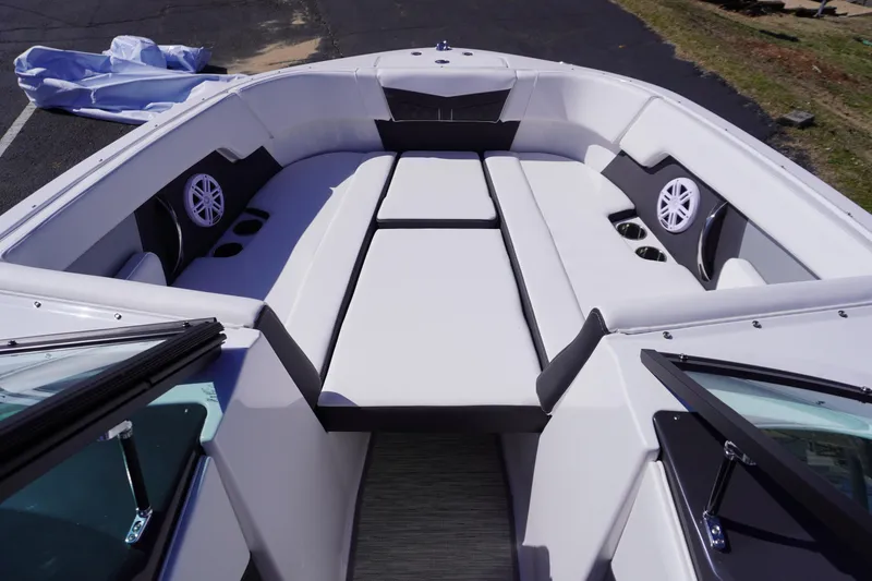 Slide: The Image of 2025 Monterey M22 boat interior with white seating and built-in speakers. - 15