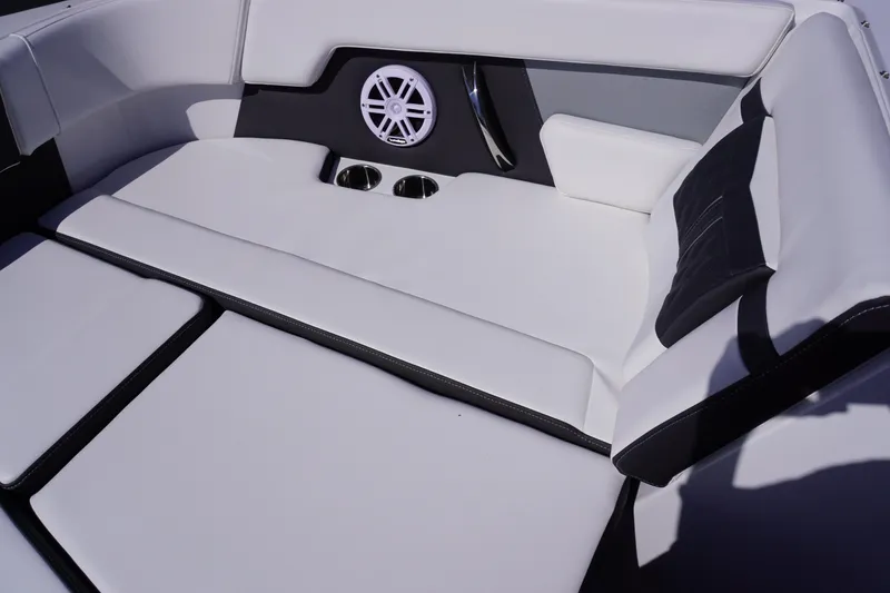Slide: The Image of Luxurious seating area on 2025 Monterey M22 boat with speaker and cup holders. - 17