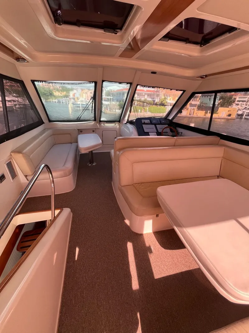 Slide: The Image of Luxurious interior of a 2007 Maritimo M60 yacht with spacious seating and panoramic windows. - 10