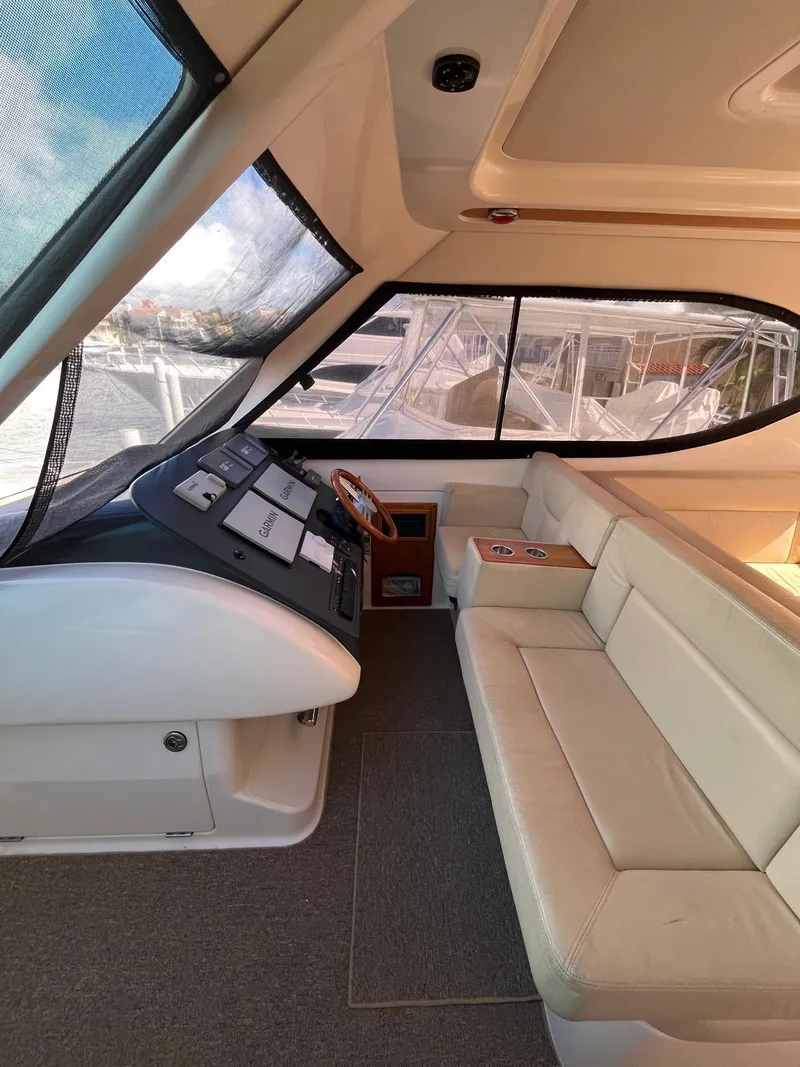 Slide: The Image of Interior of 2007 Maritimo M60 yacht with helm and beige seating. - 11