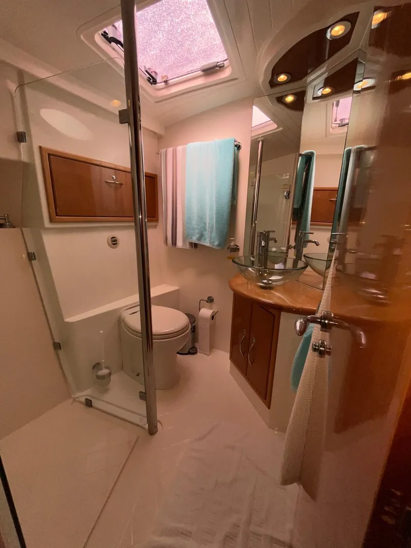 Slide: The Image of Luxurious bathroom in 2007 Maritimo M60 yacht with modern fixtures and elegant design. - 12