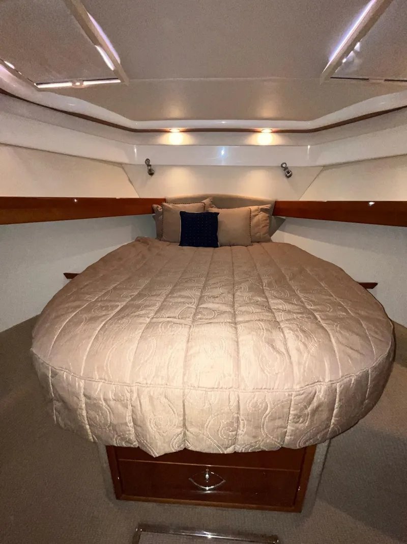 Slide: The Image of Luxurious cabin interior of 2007 Maritimo M60 yacht with cozy bedding. - 14