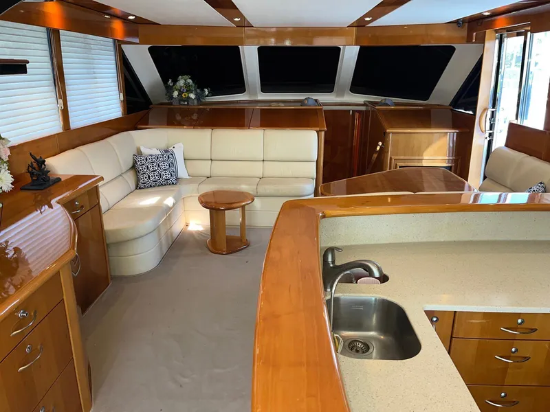 Slide: The Image of Luxurious interior of a 2007 Maritimo M60 yacht with elegant wood finishes. - 18