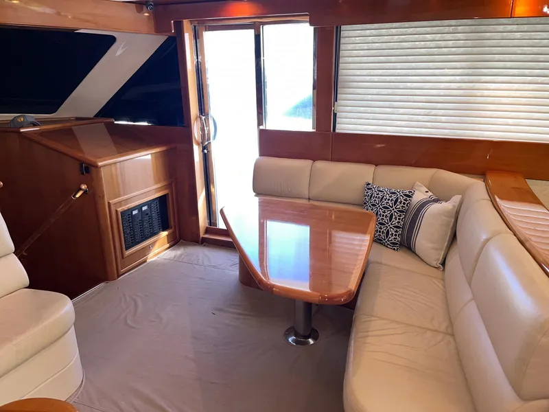 Slide: The Image of Luxurious interior of 2007 Maritimo M60 yacht with elegant seating and wooden table. - 21