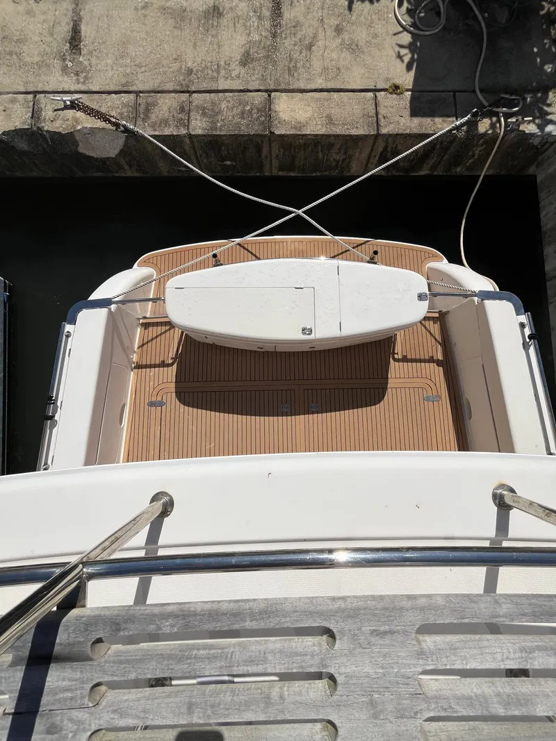 Slide: The Image of 2007 Maritimo M60 yacht stern view with wooden deck and swim platform. - 8