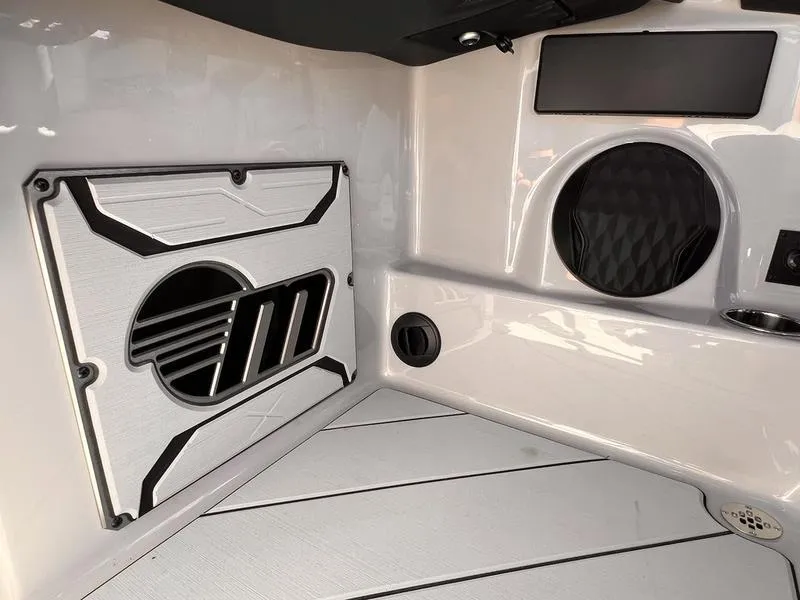 Slide: The Image of 2025 Malibu 23 LSV interior detail with sleek design and modern audio system. - 15