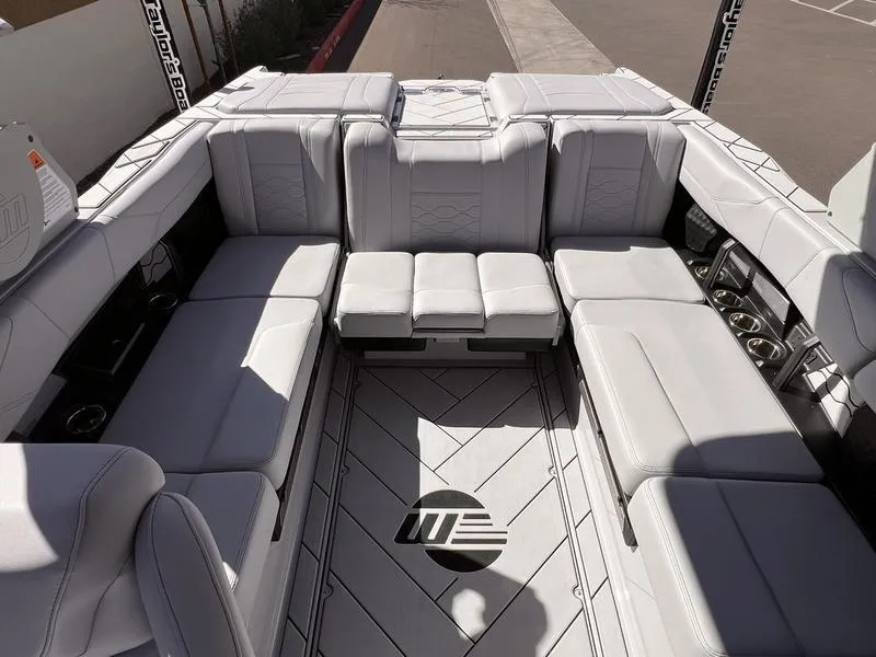 Slide: The Image of 2025 Malibu 23 LSV boat interior with luxurious seating and modern design. - 17