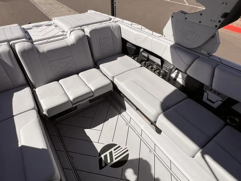 Slide: The Image of 2025 Malibu 23 LSV boat interior with luxurious seating and modern design. - 18
