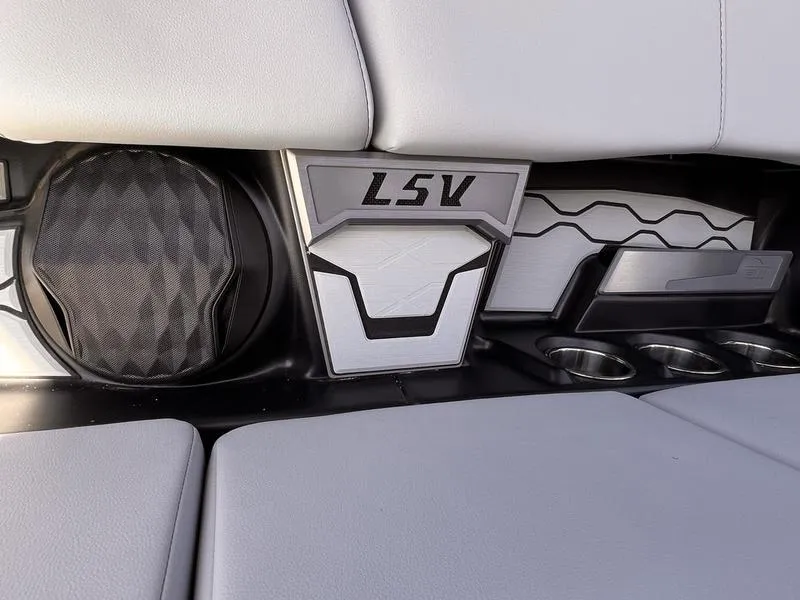 Slide: The Image of 2025 Malibu 23 LSV interior detail with speaker and cup holders. - 3